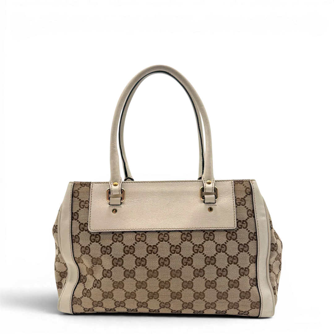 https://cdn.shopify.com/s/files/1/0564/9376/8855/files/Gucci_Handtasche_Trophy_mit_Gucci_Blume_beige_2.webp?v=1781713049