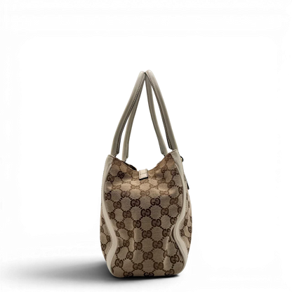 https://cdn.shopify.com/s/files/1/0564/9376/8855/files/Gucci_Handtasche_Trophy_mit_Gucci_Blume_beige_3.webp?v=1781713049