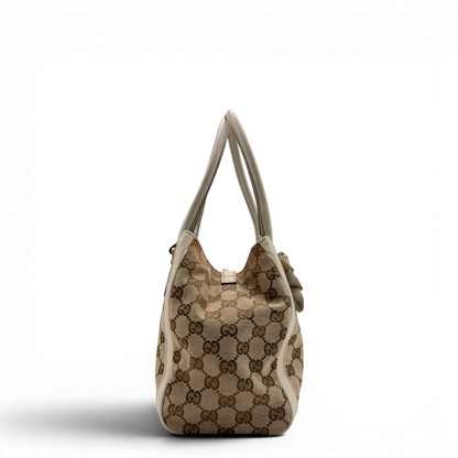 https://cdn.shopify.com/s/files/1/0564/9376/8855/files/Gucci_Handtasche_Trophy_mit_Gucci_Blume_beige_4.webp?v=1781713049