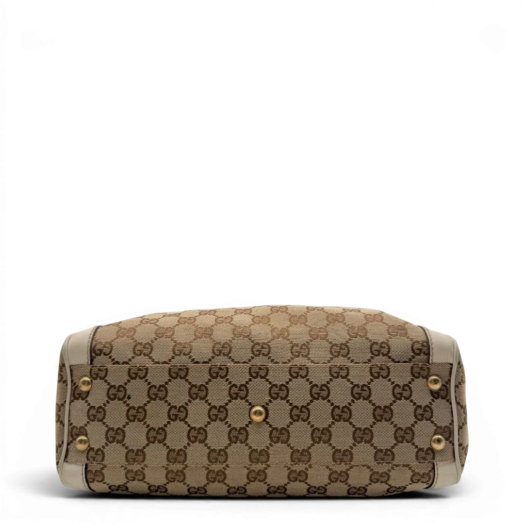 https://cdn.shopify.com/s/files/1/0564/9376/8855/files/Gucci_Handtasche_Trophy_mit_Gucci_Blume_beige_5.webp?v=1781713049