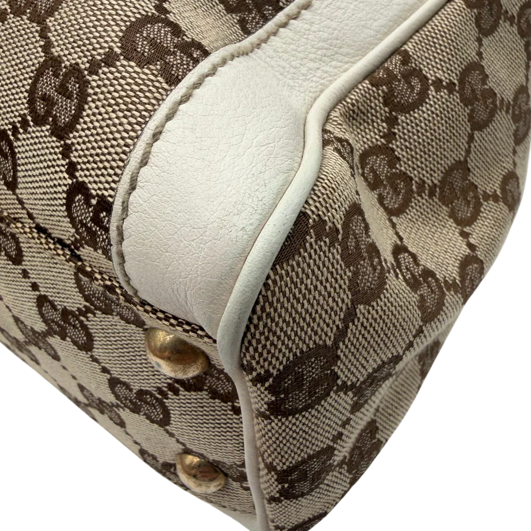 https://cdn.shopify.com/s/files/1/0564/9376/8855/files/Gucci_Handtasche_Trophy_mit_Gucci_Blume_beige_6.webp?v=1781713049