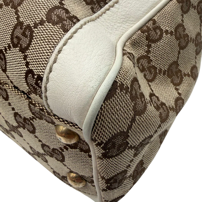 https://cdn.shopify.com/s/files/1/0564/9376/8855/files/Gucci_Handtasche_Trophy_mit_Gucci_Blume_beige_6.webp?v=1781713049