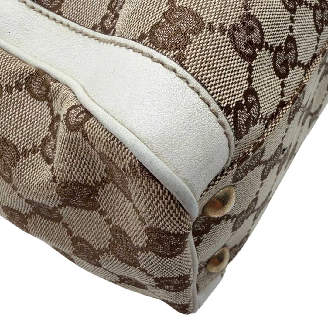 https://cdn.shopify.com/s/files/1/0564/9376/8855/files/Gucci_Handtasche_Trophy_mit_Gucci_Blume_beige_7.webp?v=1781713049