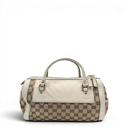 https://cdn.shopify.com/s/files/1/0564/9376/8855/files/Gucci_Handtasche_Zylinder_mit_Gucci_Blume_beige_vintage7848.webp?v=1780490136