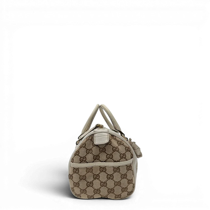 https://cdn.shopify.com/s/files/1/0564/9376/8855/files/Gucci_Handtasche_Zylinder_mit_Gucci_Blume_beige_vintage7851.webp?v=1780490136