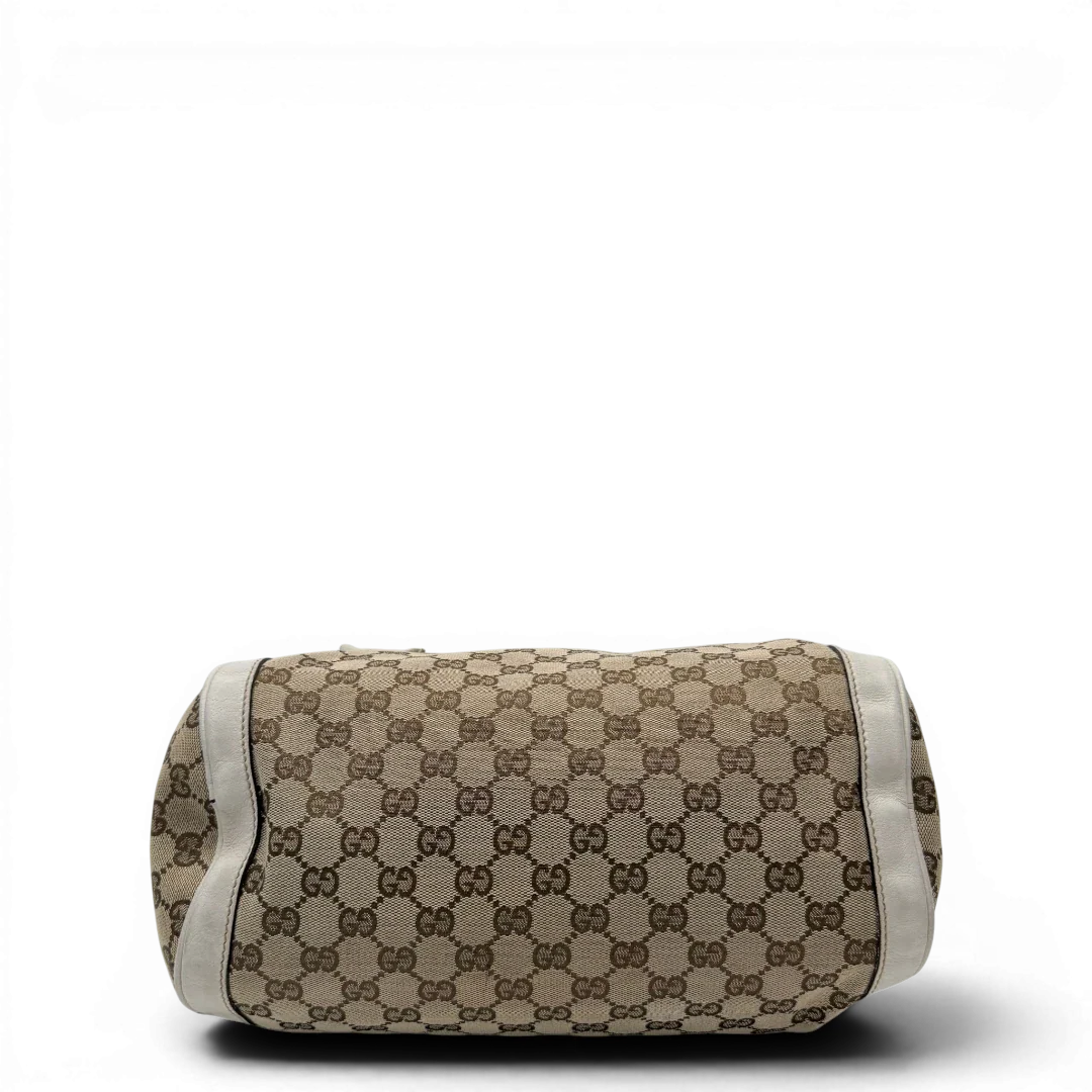 https://cdn.shopify.com/s/files/1/0564/9376/8855/files/Gucci_Handtasche_Zylinder_mit_Gucci_Blume_beige_vintage7853.webp?v=1780490136