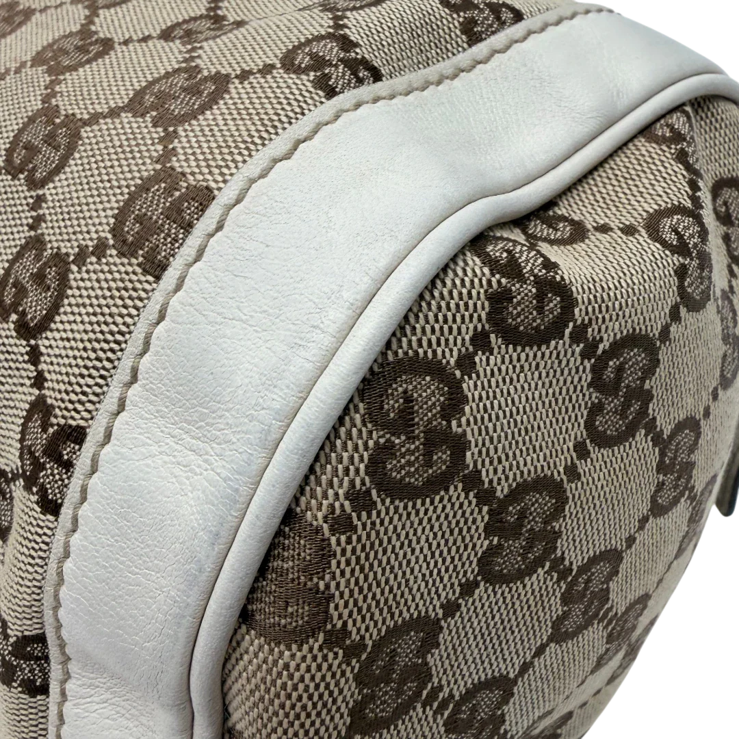 https://cdn.shopify.com/s/files/1/0564/9376/8855/files/Gucci_Handtasche_Zylinder_mit_Gucci_Blume_beige_vintage7854.webp?v=1780490137
