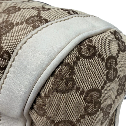 https://cdn.shopify.com/s/files/1/0564/9376/8855/files/Gucci_Handtasche_Zylinder_mit_Gucci_Blume_beige_vintage7856.webp?v=1780490138