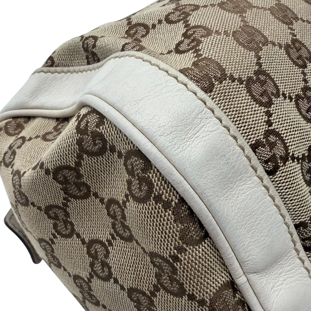 https://cdn.shopify.com/s/files/1/0564/9376/8855/files/Gucci_Handtasche_Zylinder_mit_Gucci_Blume_beige_vintage7857.webp?v=1780490137