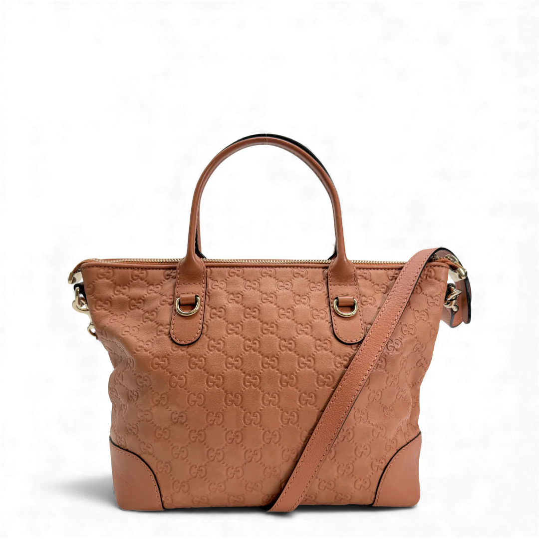 https://cdn.shopify.com/s/files/1/0564/9376/8855/files/Gucci_Handtasche_aus_Leder_monogram_rosa_vintage_GG_handbag2860.webp?v=1764852002