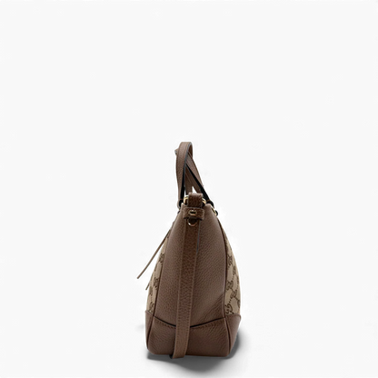 https://cdn.shopify.com/s/files/1/0564/9376/8855/files/Gucci_Handtasche_mit_Umhangegurt_monogram_beige___braun_vintage_GG_handbag3090.webp?v=1764897522