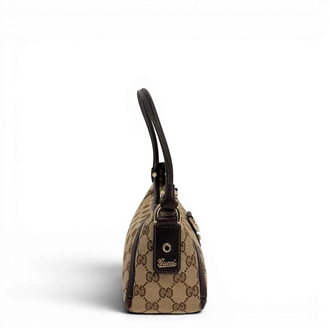 https://cdn.shopify.com/s/files/1/0564/9376/8855/files/Gucci_Pochette_Abbey_D-Ring_monogram_beige_vintage_GG6918.webp?v=1779325749