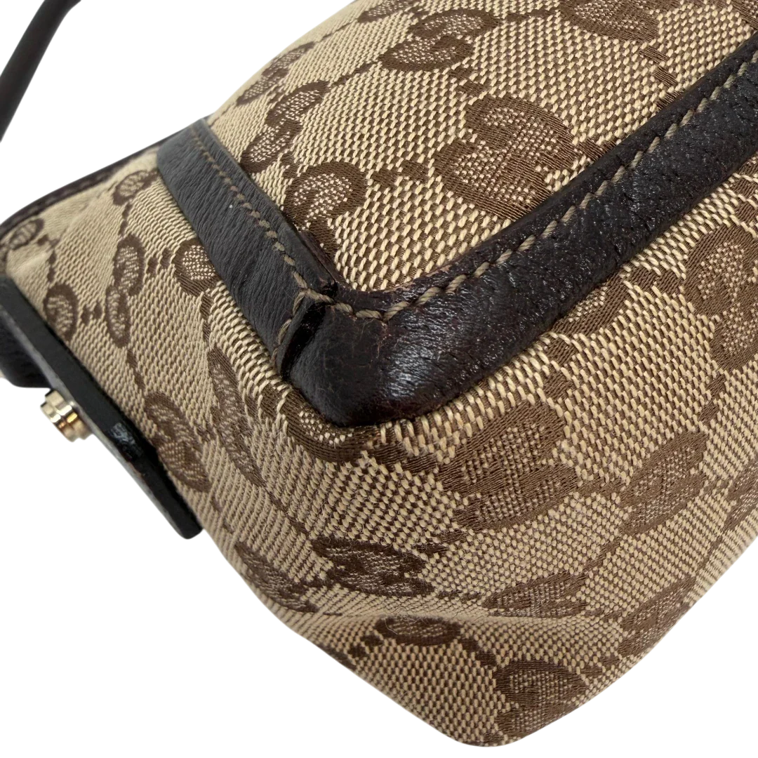 https://cdn.shopify.com/s/files/1/0564/9376/8855/files/Gucci_Pochette_Abbey_D-Ring_monogram_beige_vintage_GG6922.webp?v=1779325750