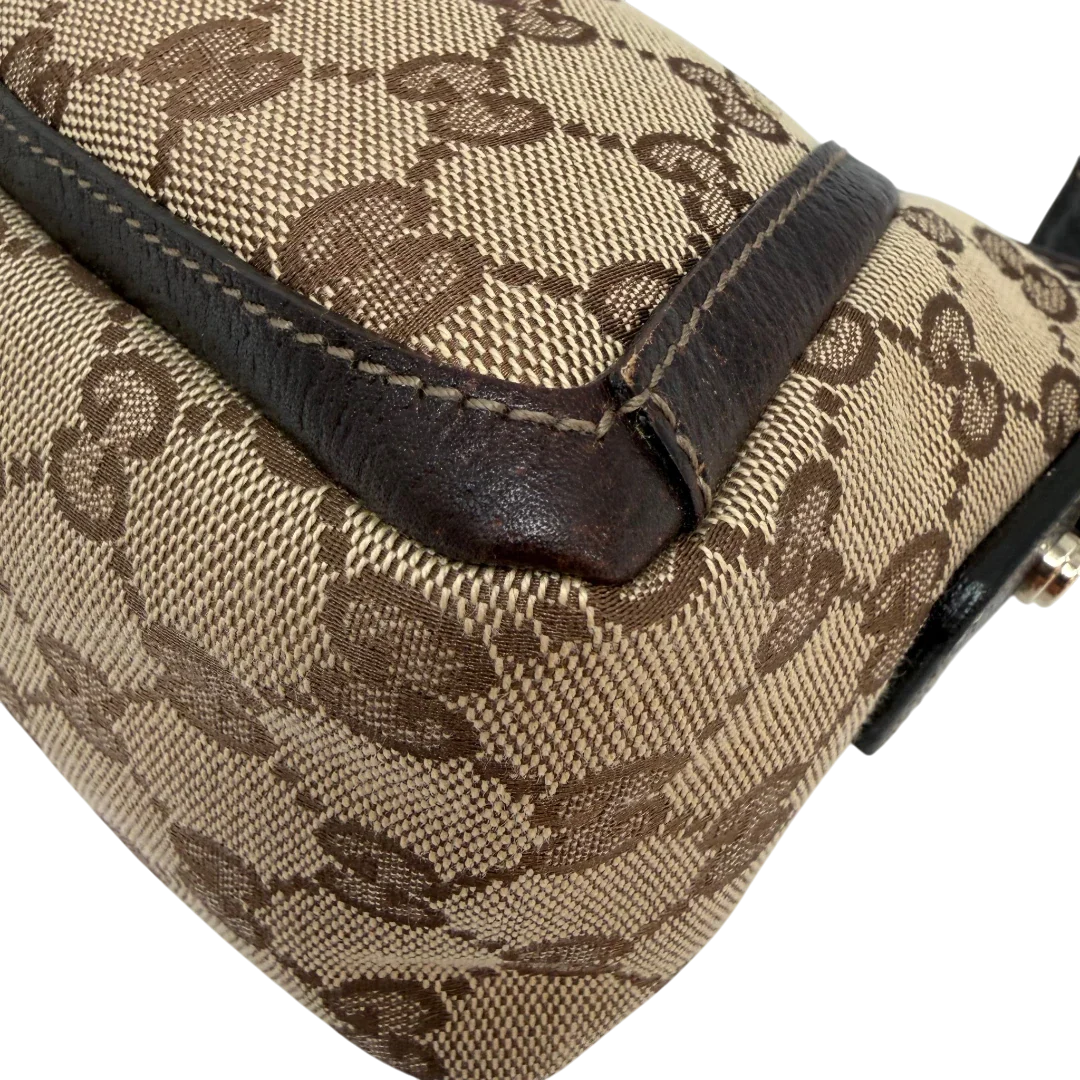 https://cdn.shopify.com/s/files/1/0564/9376/8855/files/Gucci_Pochette_Abbey_D-Ring_monogram_beige_vintage_GG6923.webp?v=1779325750