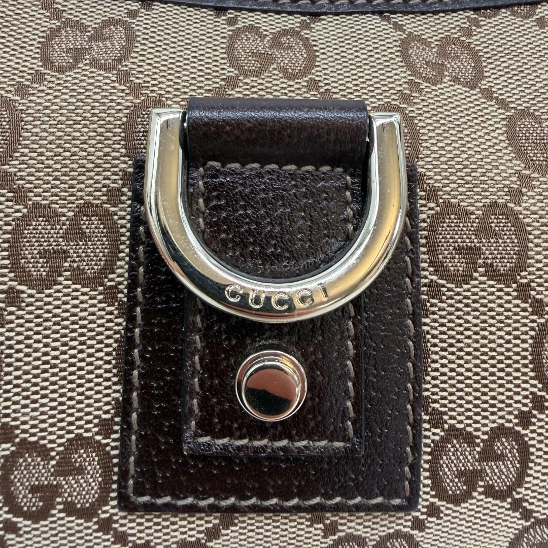 https://cdn.shopify.com/s/files/1/0564/9376/8855/files/Gucci_Pochette_Abbey_D-Ring_monogram_beige_vintage_GG6927.webp?v=1779325751