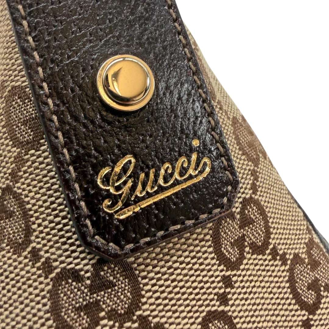 https://cdn.shopify.com/s/files/1/0564/9376/8855/files/Gucci_Pochette_Abbey_D-Ring_monogram_beige_vintage_GG6928.webp?v=1779325751