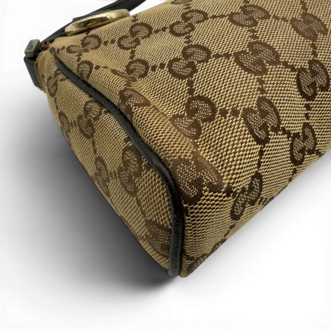 https://cdn.shopify.com/s/files/1/0564/9376/8855/files/Gucci_Pochette_Abbey_monogram_beige_7.webp?v=1782386168