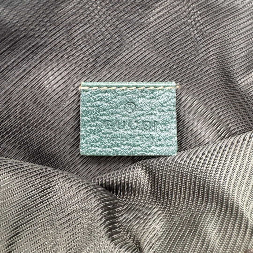 https://cdn.shopify.com/s/files/1/0564/9376/8855/files/Gucci_Pochette_Abbey_monogram_beige_vintage_GG1744.webp?v=1779408433