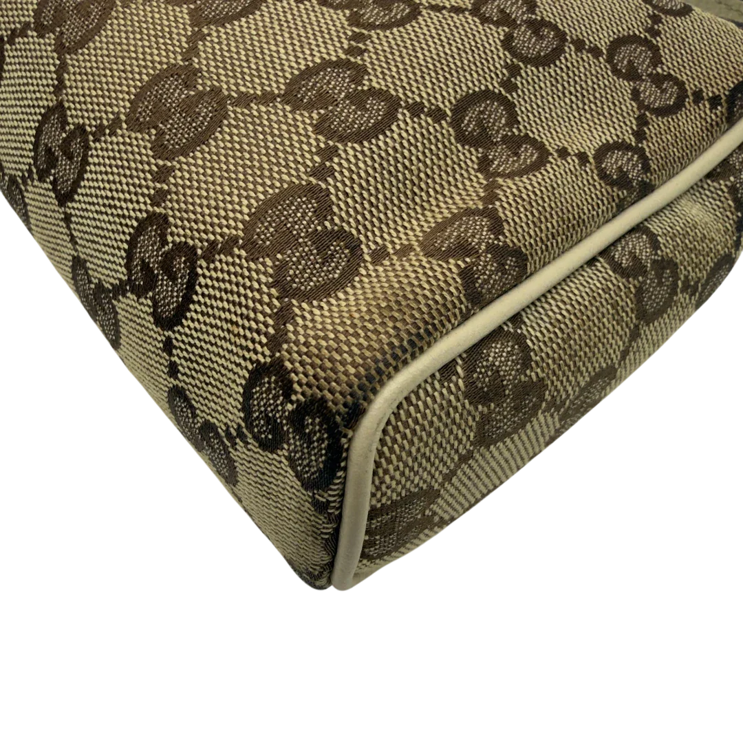 https://cdn.shopify.com/s/files/1/0564/9376/8855/files/Gucci_Pochette_Abbey_monogram_beige_vintage_GG7214.webp?v=1778683324