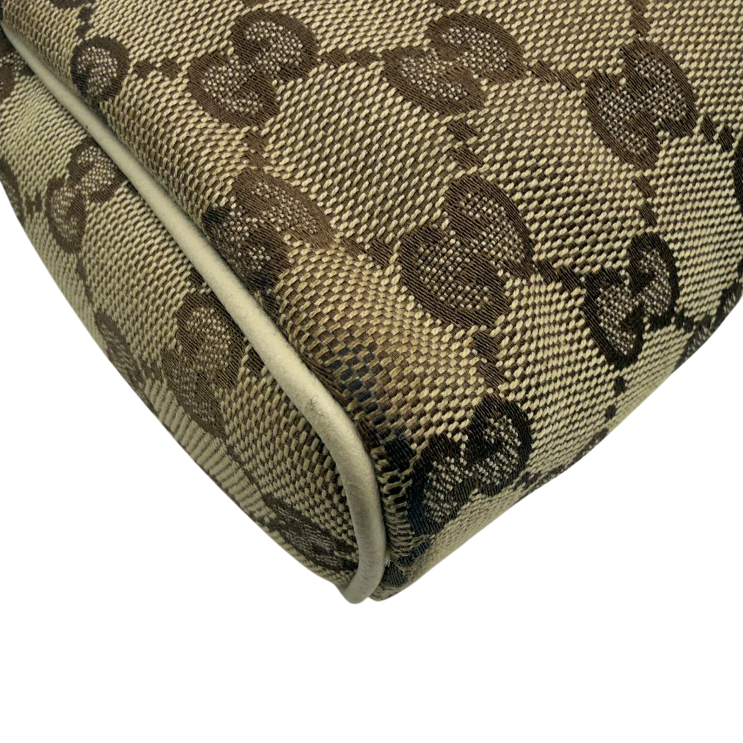 https://cdn.shopify.com/s/files/1/0564/9376/8855/files/Gucci_Pochette_Abbey_monogram_beige_vintage_GG7215.webp?v=1778683324