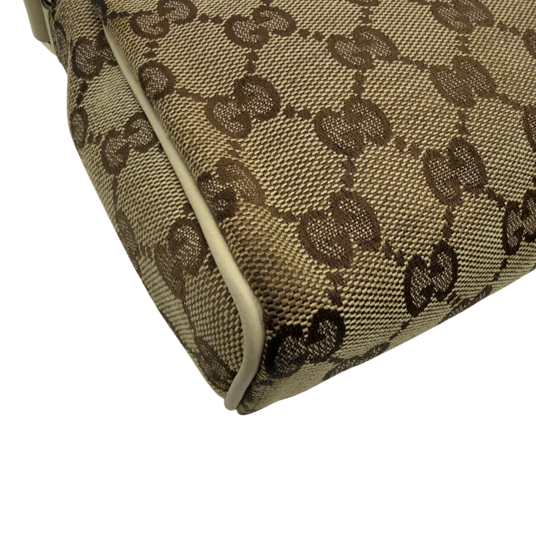 https://cdn.shopify.com/s/files/1/0564/9376/8855/files/Gucci_Pochette_Abbey_monogram_beige_vintage_GG7217.webp?v=1778683324