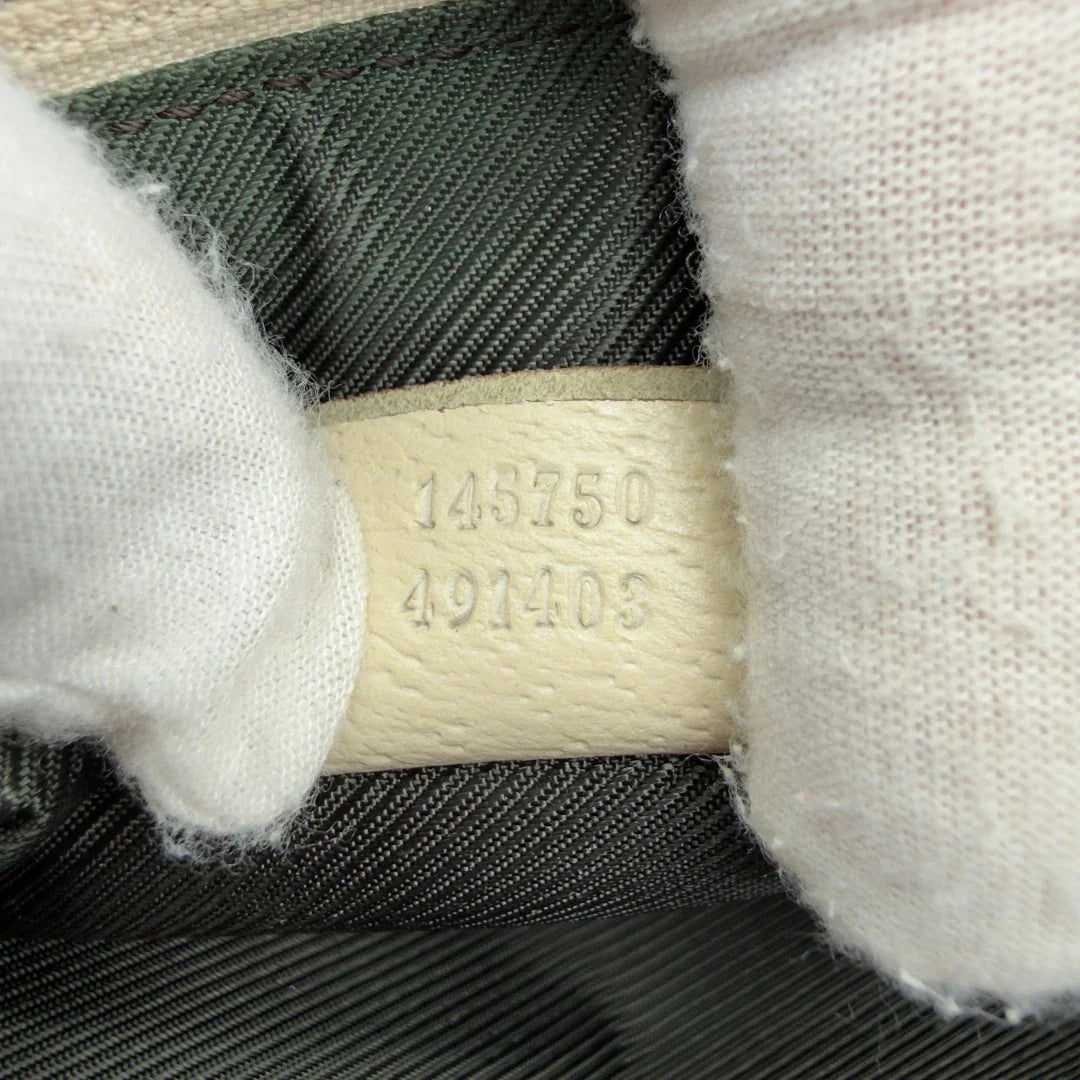 https://cdn.shopify.com/s/files/1/0564/9376/8855/files/Gucci_Pochette_Abbey_monogram_beige_vintage_GG7222.webp?v=1778683324