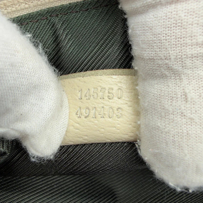 https://cdn.shopify.com/s/files/1/0564/9376/8855/files/Gucci_Pochette_Abbey_monogram_beige_vintage_GG7222.webp?v=1778683324