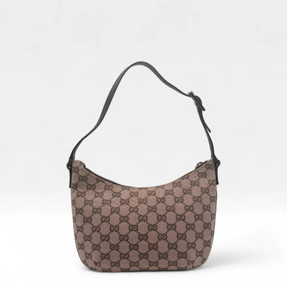 https://cdn.shopify.com/s/files/1/0564/9376/8855/files/Gucci_Pochette_Croissant_monogram_braun_vintage_GG1326.webp?v=1762427344