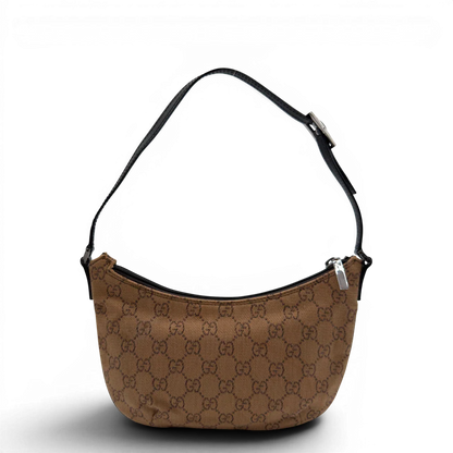 https://cdn.shopify.com/s/files/1/0564/9376/8855/files/Gucci_Pochette_Croissant_monogram_braun_vintage_GG7550.webp?v=1779319552