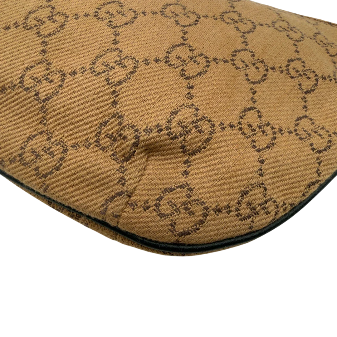 https://cdn.shopify.com/s/files/1/0564/9376/8855/files/Gucci_Pochette_Croissant_monogram_braun_vintage_GG7555.webp?v=1779319553