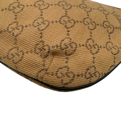 https://cdn.shopify.com/s/files/1/0564/9376/8855/files/Gucci_Pochette_Croissant_monogram_braun_vintage_GG7555.webp?v=1779319553