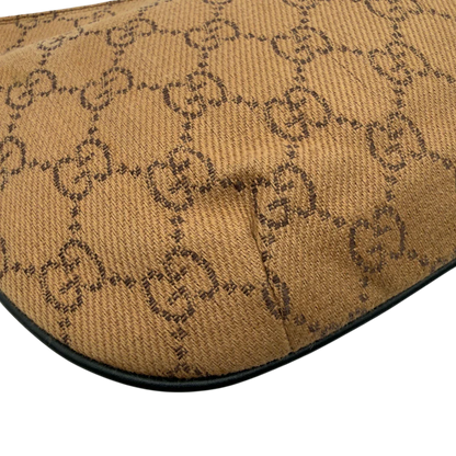 https://cdn.shopify.com/s/files/1/0564/9376/8855/files/Gucci_Pochette_Croissant_monogram_braun_vintage_GG7556.webp?v=1779319553