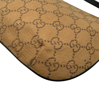 https://cdn.shopify.com/s/files/1/0564/9376/8855/files/Gucci_Pochette_Croissant_monogram_braun_vintage_GG7557.webp?v=1779319553