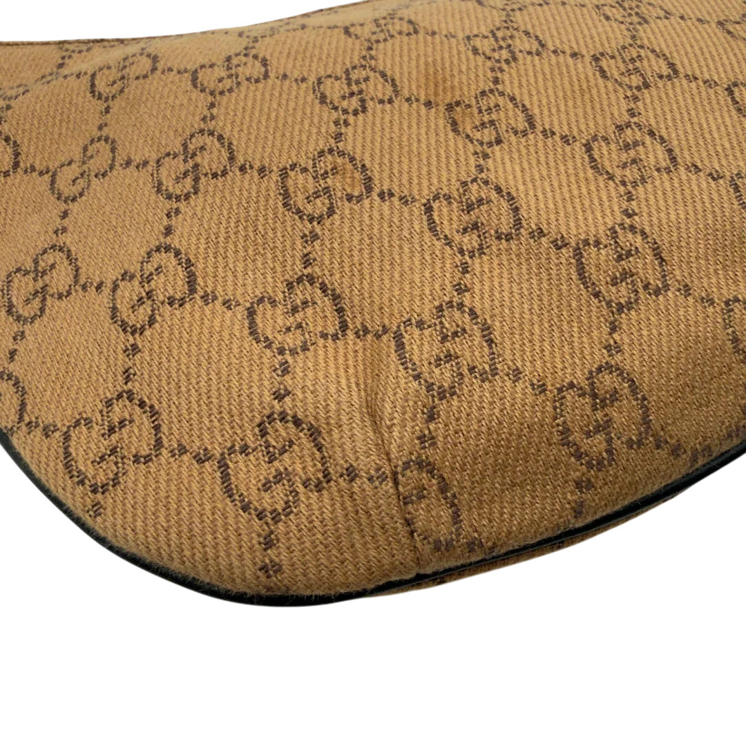 https://cdn.shopify.com/s/files/1/0564/9376/8855/files/Gucci_Pochette_Croissant_monogram_braun_vintage_GG7558.webp?v=1779319553