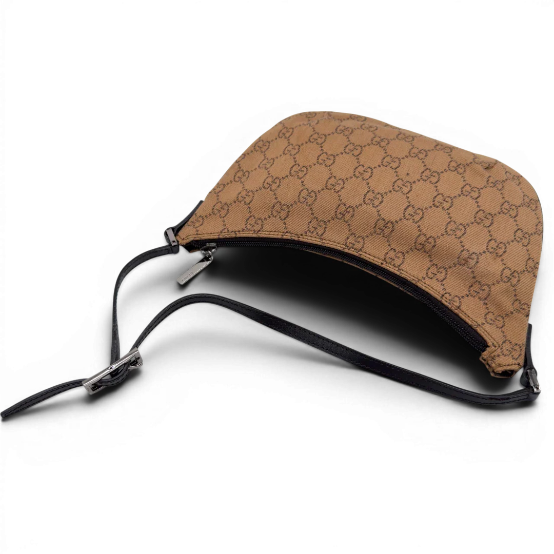 https://cdn.shopify.com/s/files/1/0564/9376/8855/files/Gucci_Pochette_Croissant_monogram_braun_vintage_GG7559.webp?v=1779319553