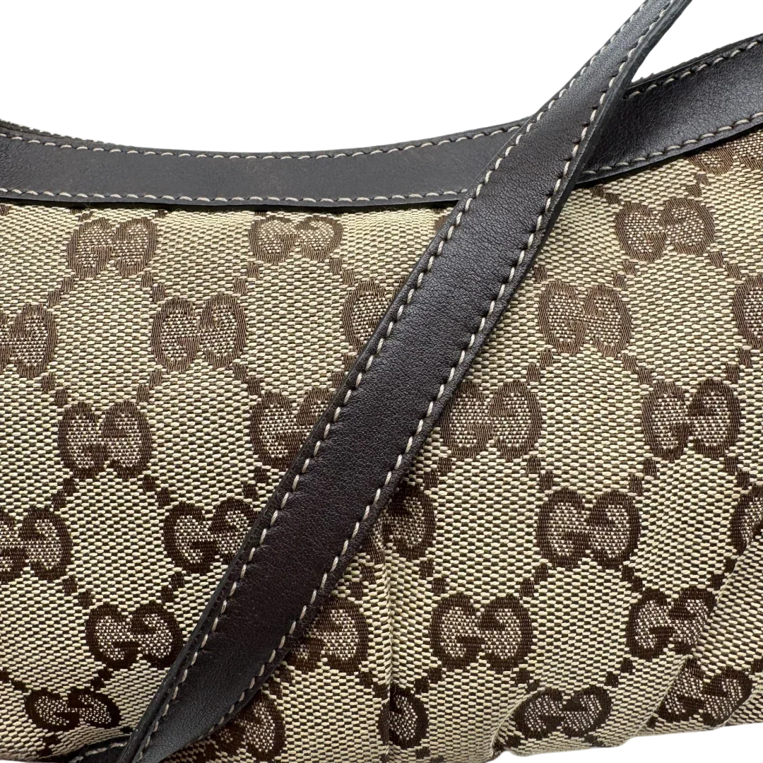 https://cdn.shopify.com/s/files/1/0564/9376/8855/files/Gucci_Pochette_Lovely_mit_GG_Herz_monogram_beige_15.webp?v=1783514913