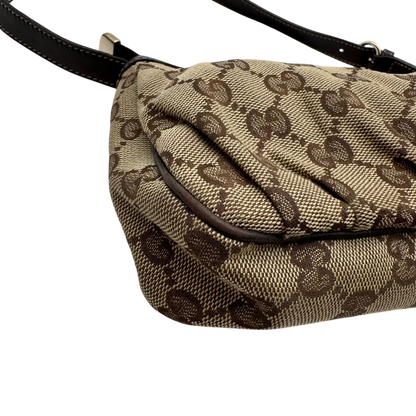 https://cdn.shopify.com/s/files/1/0564/9376/8855/files/Gucci_Pochette_Lovely_mit_GG_Herz_monogram_beige_6.webp?v=1783514912