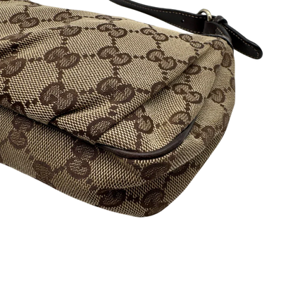 https://cdn.shopify.com/s/files/1/0564/9376/8855/files/Gucci_Pochette_Lovely_mit_GG_Herz_monogram_beige_7.webp?v=1783514913