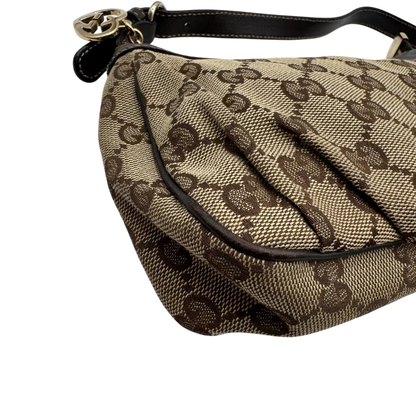 https://cdn.shopify.com/s/files/1/0564/9376/8855/files/Gucci_Pochette_Lovely_mit_GG_Herz_monogram_beige_8.webp?v=1783514912