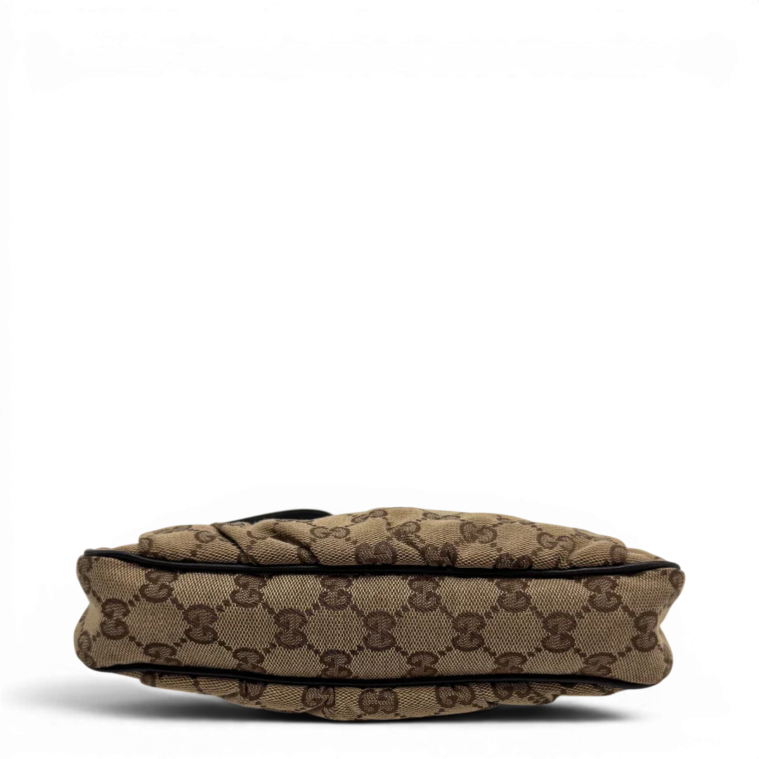 https://cdn.shopify.com/s/files/1/0564/9376/8855/files/Gucci_Pochette_Lovely_mit_GG_Herz_monogram_beige_vintage_GG2374.webp?v=1779966528