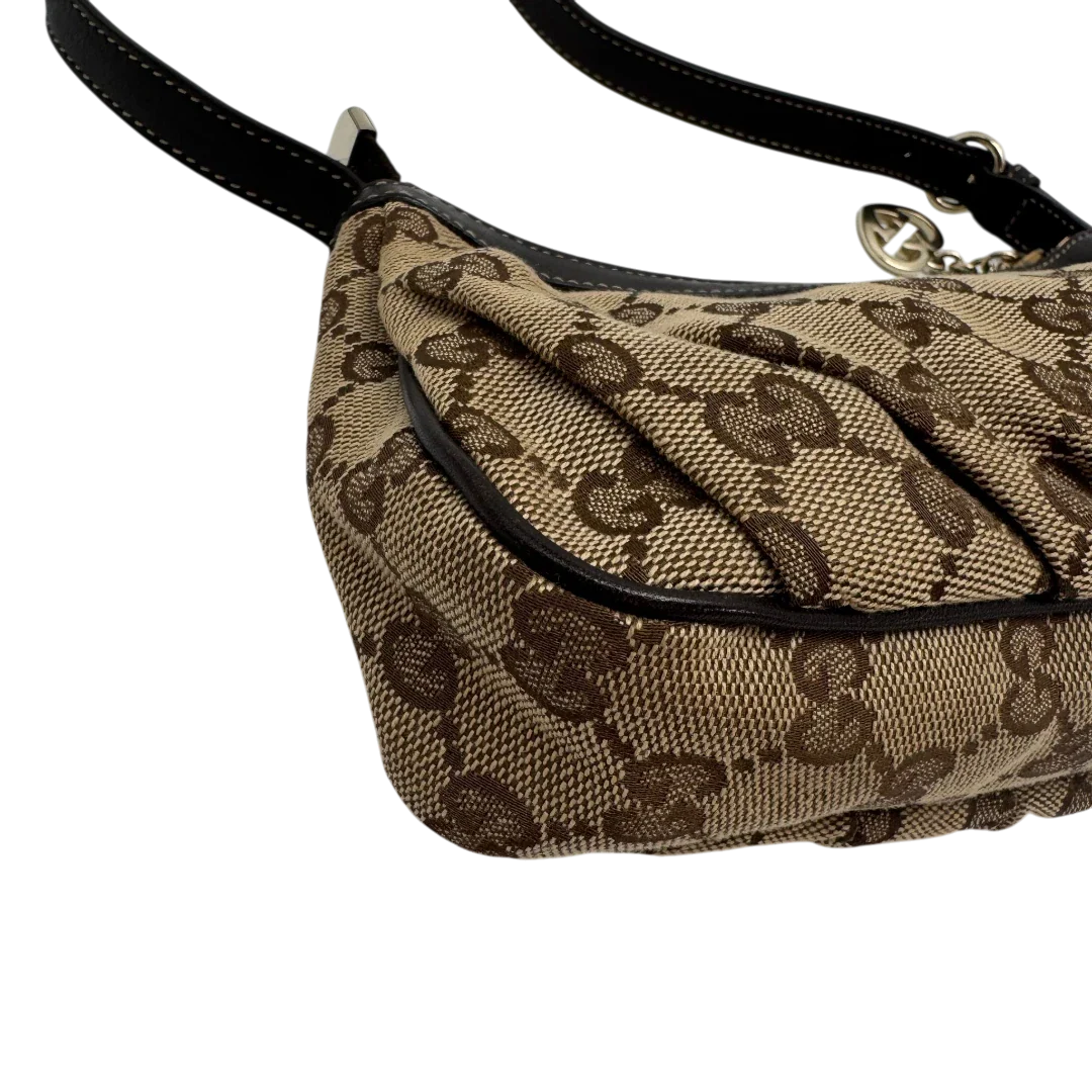 https://cdn.shopify.com/s/files/1/0564/9376/8855/files/Gucci_Pochette_Lovely_mit_GG_Herz_monogram_beige_vintage_GG2375.webp?v=1779966529