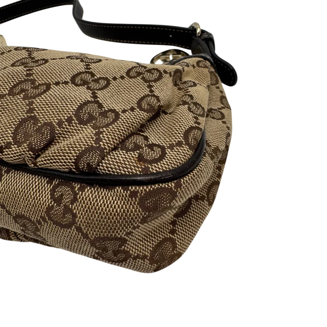 https://cdn.shopify.com/s/files/1/0564/9376/8855/files/Gucci_Pochette_Lovely_mit_GG_Herz_monogram_beige_vintage_GG2376.webp?v=1779966529