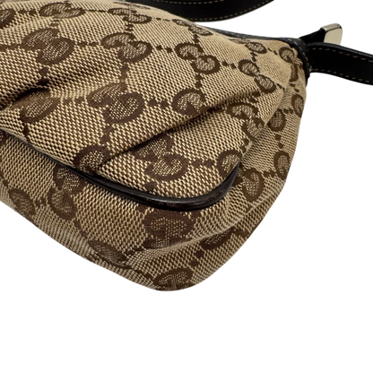https://cdn.shopify.com/s/files/1/0564/9376/8855/files/Gucci_Pochette_Lovely_mit_GG_Herz_monogram_beige_vintage_GG2378.webp?v=1779966529