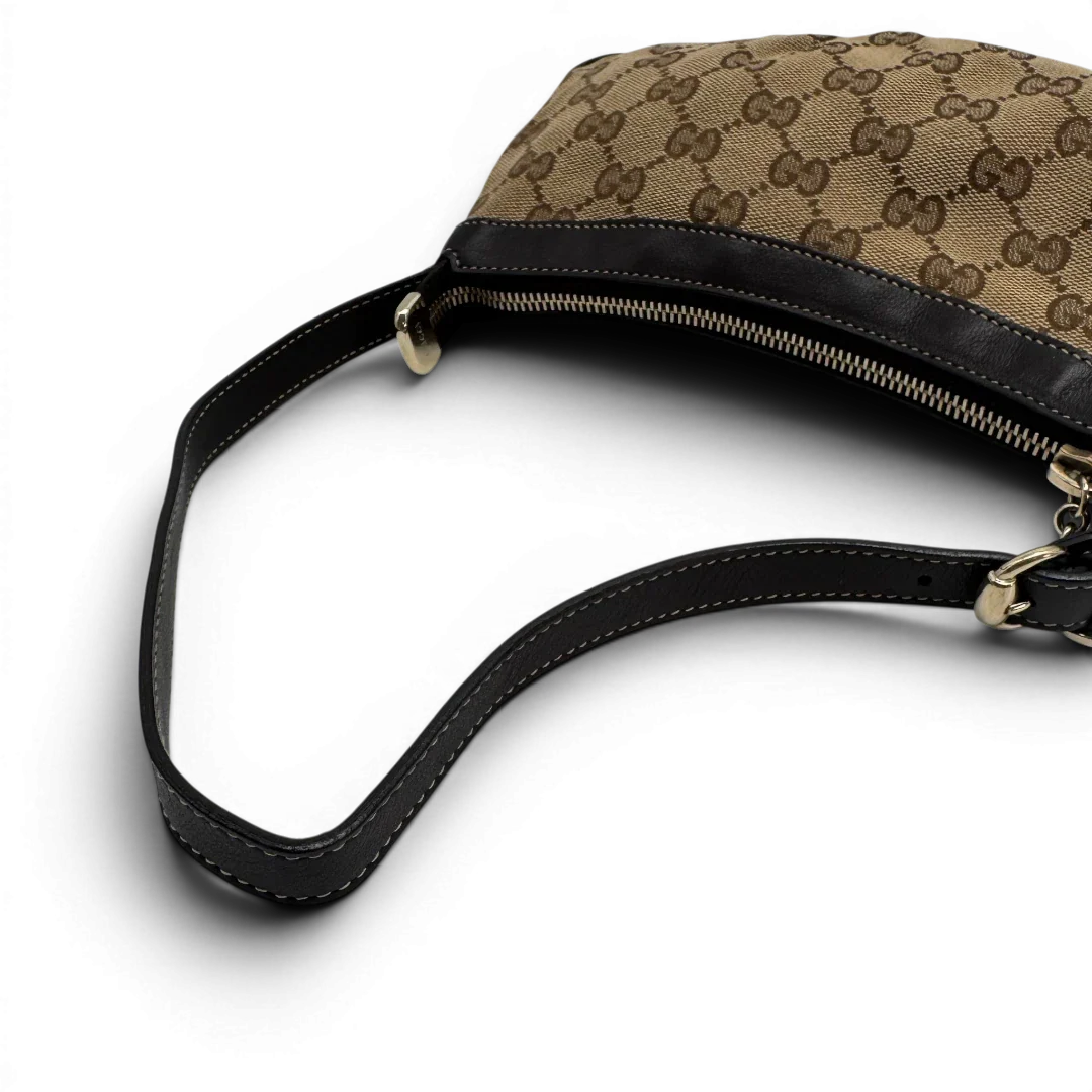 https://cdn.shopify.com/s/files/1/0564/9376/8855/files/Gucci_Pochette_Lovely_mit_GG_Herz_monogram_beige_vintage_GG2379.webp?v=1779966528
