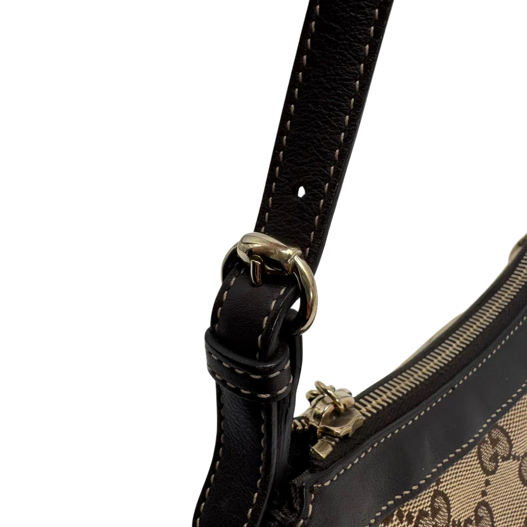 https://cdn.shopify.com/s/files/1/0564/9376/8855/files/Gucci_Pochette_Lovely_mit_GG_Herz_monogram_beige_vintage_GG2382.webp?v=1779966528
