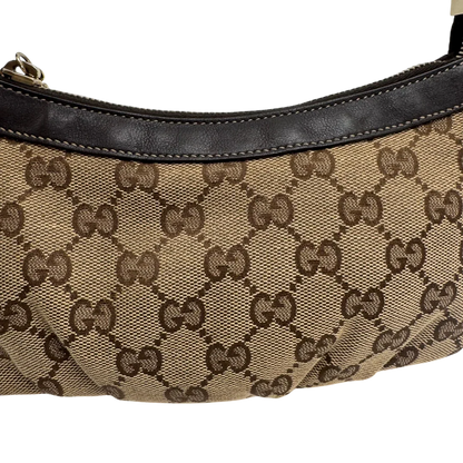 https://cdn.shopify.com/s/files/1/0564/9376/8855/files/Gucci_Pochette_Lovely_mit_GG_Herz_monogram_beige_vintage_GG2383.webp?v=1779966529