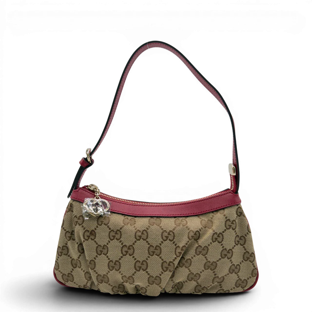 https://cdn.shopify.com/s/files/1/0564/9376/8855/files/Gucci_Pochette_Lovely_mit_GG_Herz_monogram_beige_vintage_GG7501.webp?v=1779286741