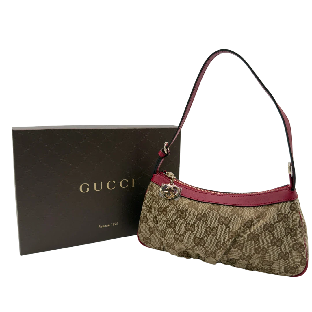 https://cdn.shopify.com/s/files/1/0564/9376/8855/files/Gucci_Pochette_Lovely_mit_GG_Herz_monogram_beige_vintage_GG7518.webp?v=1779286740