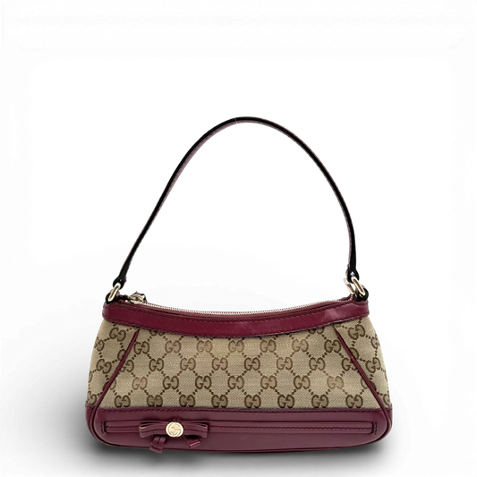 https://cdn.shopify.com/s/files/1/0564/9376/8855/files/Gucci_Pochette_Mayfair_mit_rotem_Leder_monogram_beige_vintage_GG_0653.webp?v=1770287885