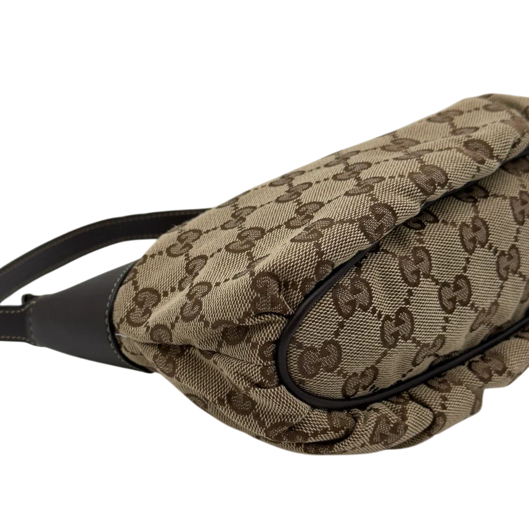 https://cdn.shopify.com/s/files/1/0564/9376/8855/files/Gucci_Pochette_Sherry_Line_monogram_beige_12.webp?v=1784281813